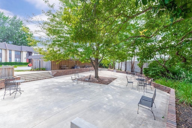 view of patio featuring an outbuilding
