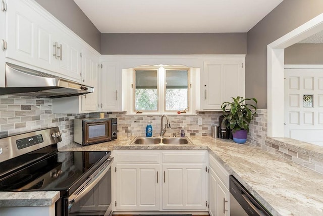 kitchen with black microwave, a sink, light countertops, under cabinet range hood, and stainless steel electric stove