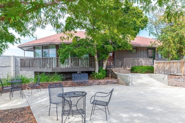 view of patio featuring outdoor dining area