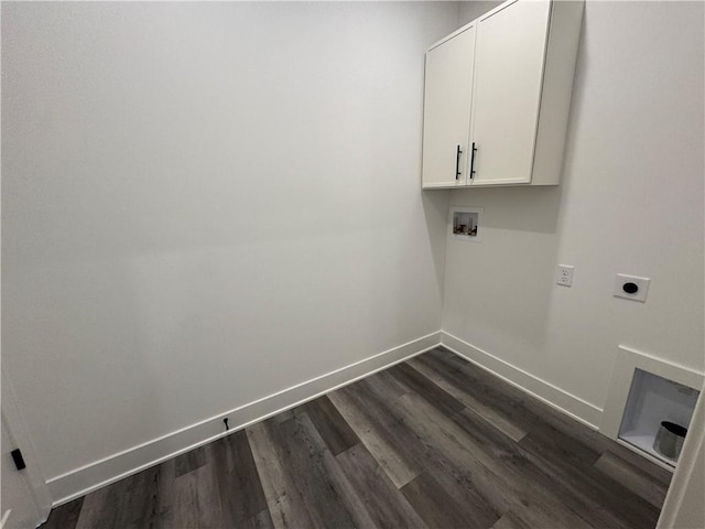 clothes washing area with cabinet space, dark wood-style flooring, washer hookup, baseboards, and hookup for an electric dryer