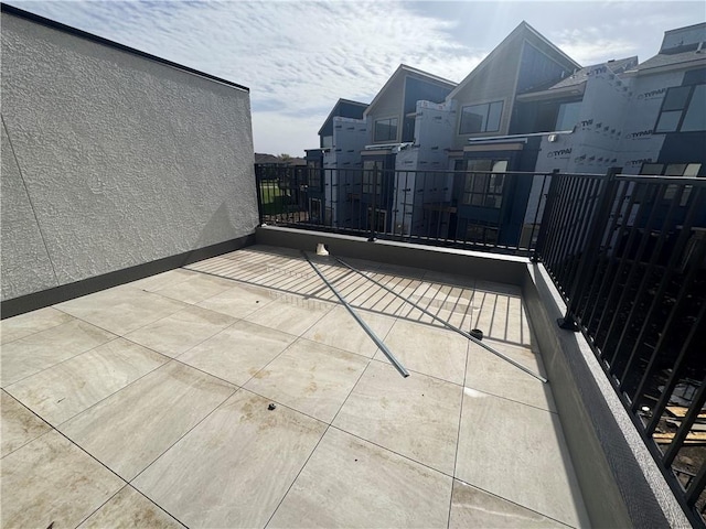 view of patio featuring a balcony