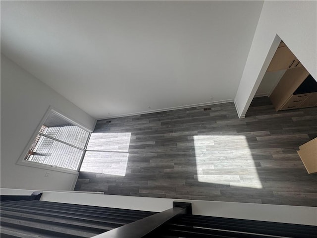 staircase featuring wood finished floors