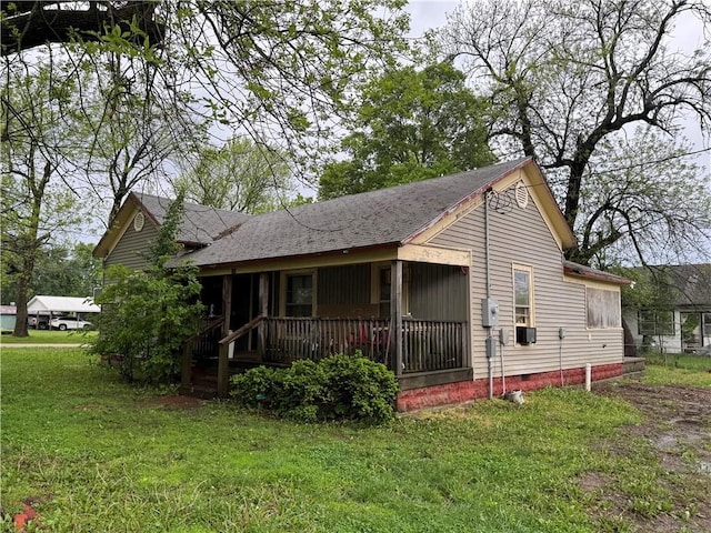 exterior space featuring a lawn, crawl space, and a porch