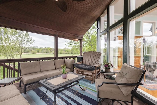 exterior space with a ceiling fan and outdoor lounge area