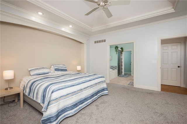 bedroom with visible vents, a raised ceiling, ornamental molding, light carpet, and recessed lighting