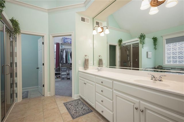 bathroom featuring double vanity, visible vents, a sink, and vaulted ceiling