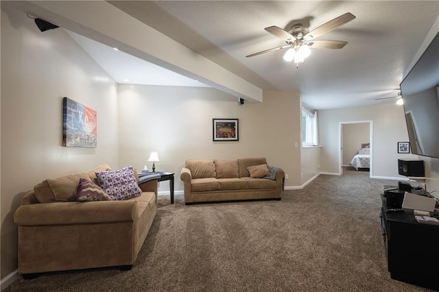 living room featuring carpet floors, baseboards, and a ceiling fan