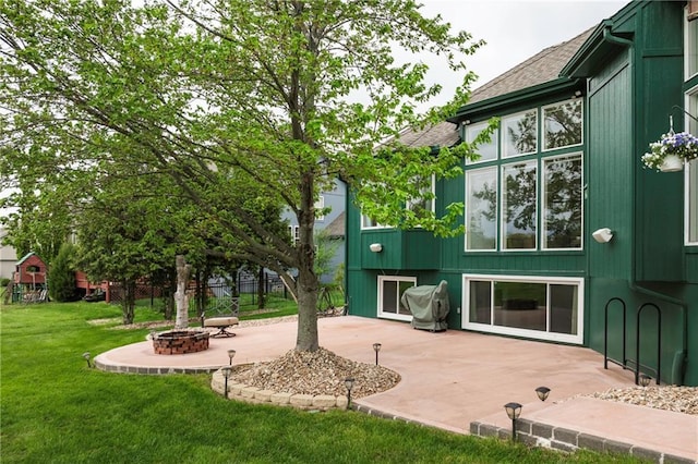 exterior space featuring a fire pit and a patio area