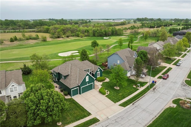 aerial view with view of golf course and a residential view
