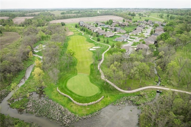 bird's eye view with view of golf course and a residential view