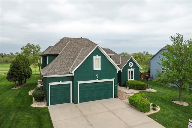 view of front of house featuring driveway, a front yard, a garage, a shingled roof, and stucco siding