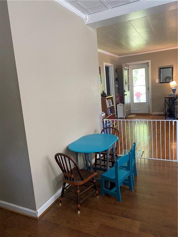 1404 S Barrett Ave, Sedalia, MO 65301 - dining room with crown molding, baseboards, and wood-type flooring