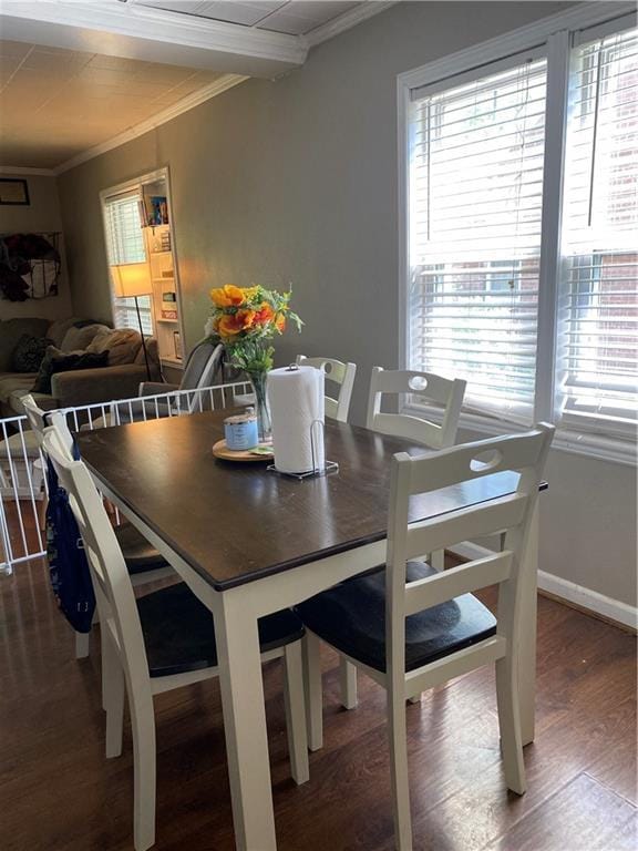 1404 S Barrett Ave, Sedalia, MO 65301 - dining area with plenty of natural light, ornamental molding, baseboards, and wood finished floors