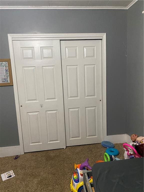1404 S Barrett Ave, Sedalia, MO 65301 - recreation room featuring crown molding, carpet flooring, and baseboards