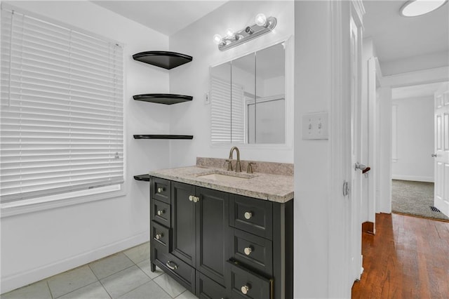 108 N Lawn Ave, Kansas City, MO 64123 - bathroom with baseboards and vanity