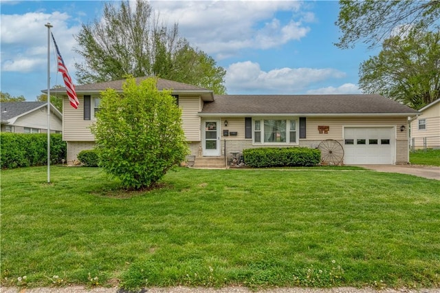 1003 Leone Ave, Sedalia, MO 65301 - split level home featuring concrete driveway, an attached garage, entry steps, and a front lawn