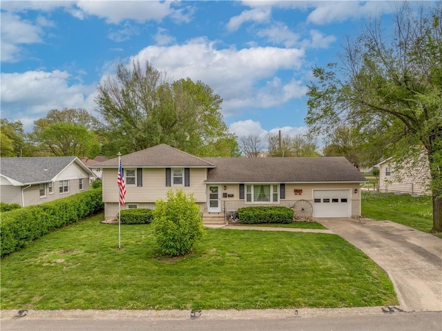 1003 Leone Ave, Sedalia, MO 65301 - split level home with a garage, driveway, and a front lawn