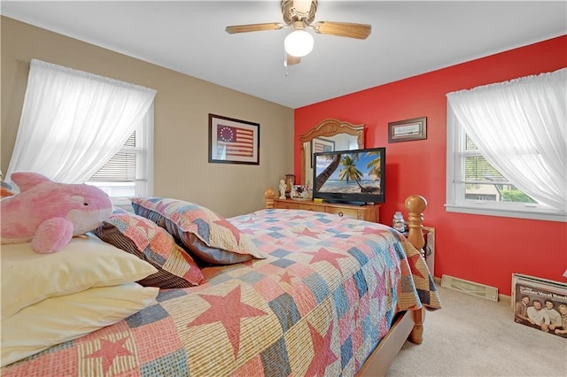 1003 Leone Ave, Sedalia, MO 65301 - carpeted bedroom with ceiling fan and visible vents