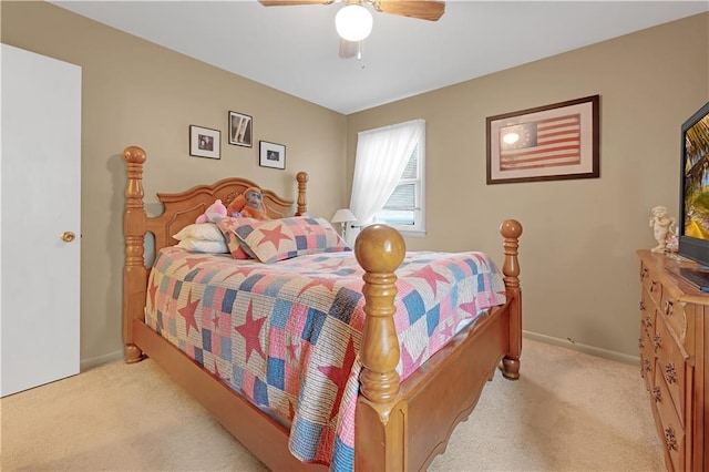 1003 Leone Ave, Sedalia, MO 65301 - bedroom featuring baseboards, a ceiling fan, and light carpet