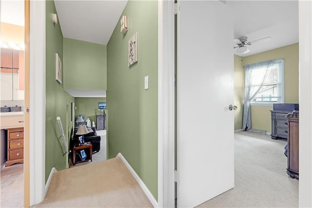 1003 Leone Ave, Sedalia, MO 65301 - corridor featuring baseboards and light carpet