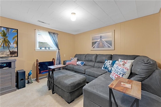 1003 Leone Ave, Sedalia, MO 65301 - living area featuring light colored carpet, visible vents, and a decorative wall
