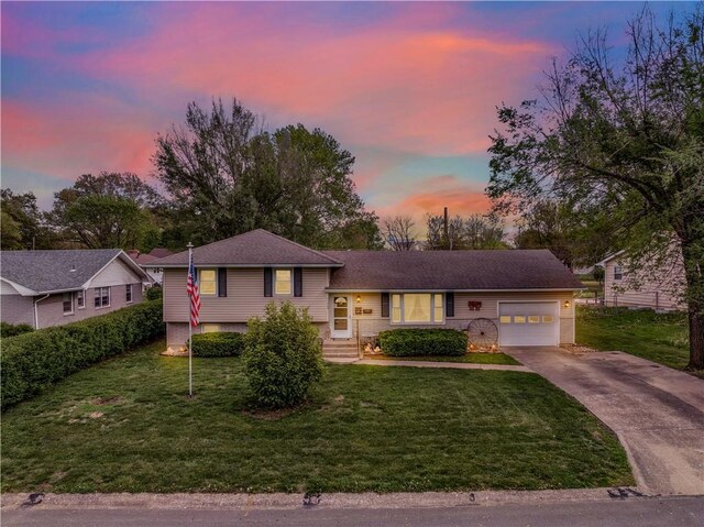 1003 Leone Ave, Sedalia, MO 65301 - split level home featuring a garage, a yard, and driveway