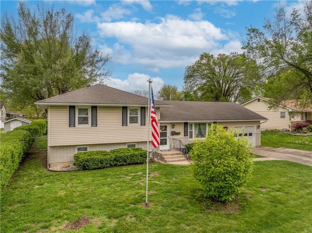 1003 Leone Ave, Sedalia, MO 65301 - tri-level home with an attached garage, driveway, and a front lawn