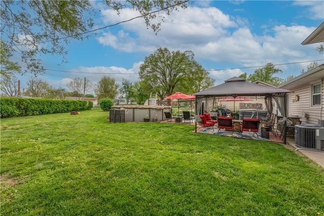 1003 Leone Ave, Sedalia, MO 65301 - view of yard with an outdoor living space, central air condition unit, a gazebo, a patio, and a covered pool