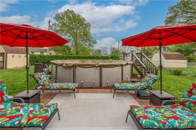 1003 Leone Ave, Sedalia, MO 65301 - view of patio with a storage shed, an outbuilding, a wooden deck, fence, and stairs