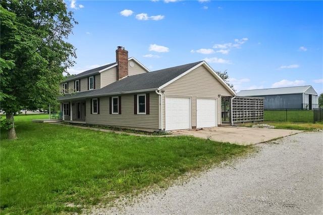 19707 E State Route A, Archie, MO 64725 - view of side of home featuring a chimney, a garage, and driveway