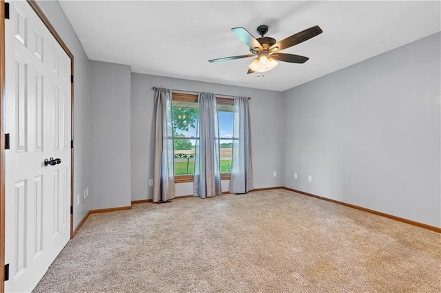 19707 E State Route A, Archie, MO 64725 - spare room with carpet, baseboards, and ceiling fan