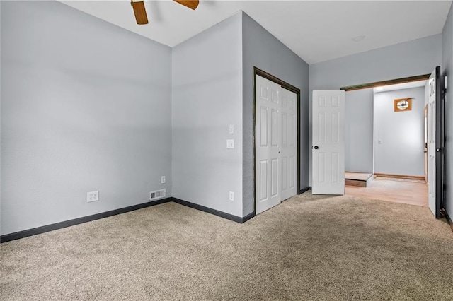 19707 E State Route A, Archie, MO 64725 - unfurnished bedroom featuring carpet floors, baseboards, a closet, and a ceiling fan