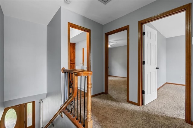 19707 E State Route A, Archie, MO 64725 - hallway featuring carpet flooring, an upstairs landing, and baseboards