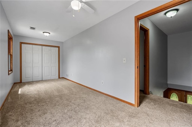 19707 E State Route A, Archie, MO 64725 - unfurnished bedroom featuring carpet, a closet, baseboards, and ceiling fan