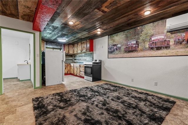 19707 E State Route A, Archie, MO 64725 - kitchen featuring stainless steel electric range, freestanding refrigerator, an AC wall unit, baseboards, and backsplash