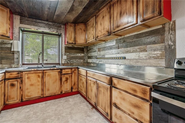 19707 E State Route A, Archie, MO 64725 - kitchen with black electric range, a sink, brown cabinets, and stainless steel counters