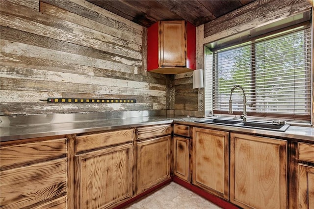19707 E State Route A, Archie, MO 64725 - kitchen featuring stainless steel counters, wood walls, a sink, wooden ceiling, and brown cabinets