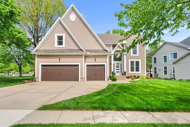 view of front facade featuring a garage, a front lawn, stucco siding, and driveway