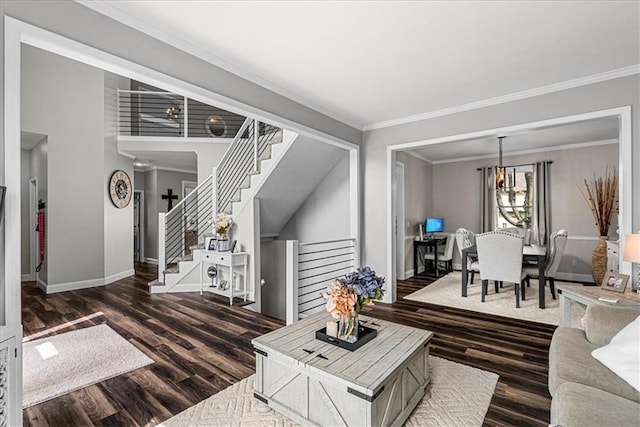 living area with crown molding, baseboards, stairs, and dark wood-style floors