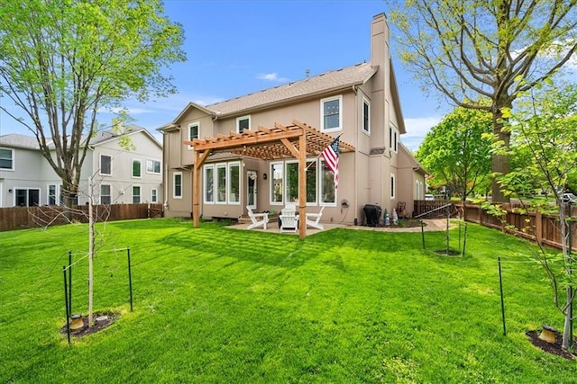 back of property featuring a fenced backyard, a pergola, a lawn, and a patio area