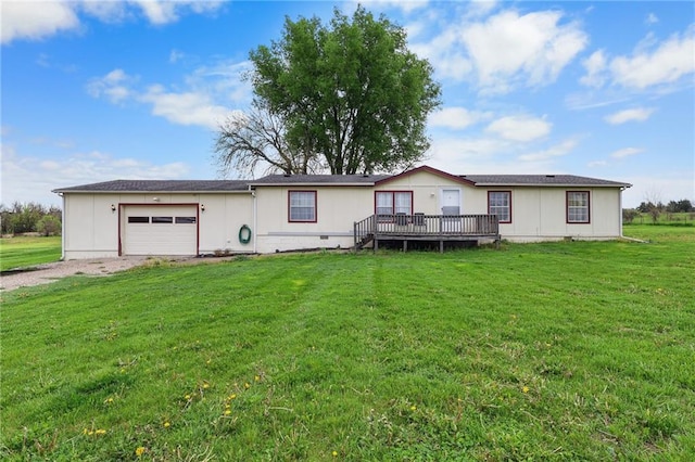 view of front of home featuring driveway, a wooden deck, a front yard, and a garage