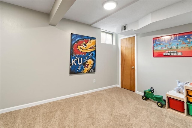 game room featuring visible vents, carpet flooring, and baseboards
