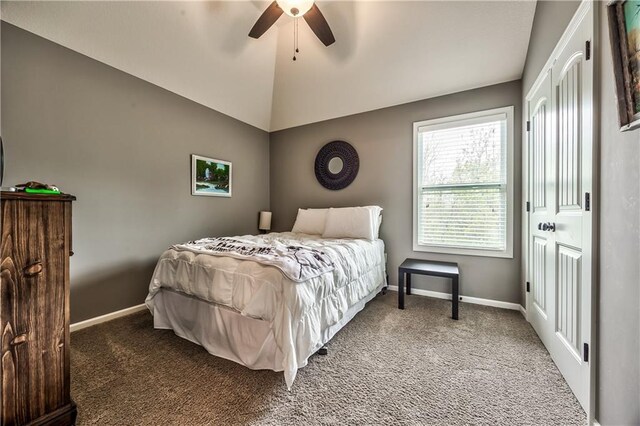 carpeted bedroom with baseboards, ceiling fan, and lofted ceiling