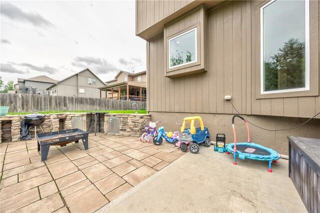 view of patio / terrace featuring fence