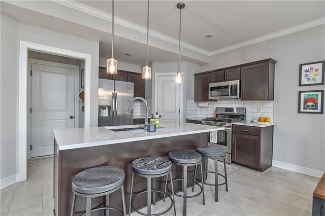 16223 Moon Shot St, Parkville, MO 64152 - kitchen featuring stainless steel appliances, baseboards, a sink, and dark brown cabinets
