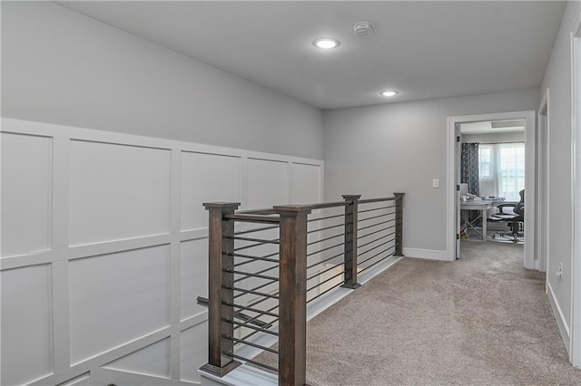 16223 Moon Shot St, Parkville, MO 64152 - hallway with wainscoting, a decorative wall, carpet, recessed lighting, and an upstairs landing