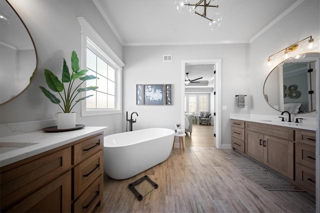 full bathroom featuring a sink, visible vents, ensuite bath, and a wealth of natural light