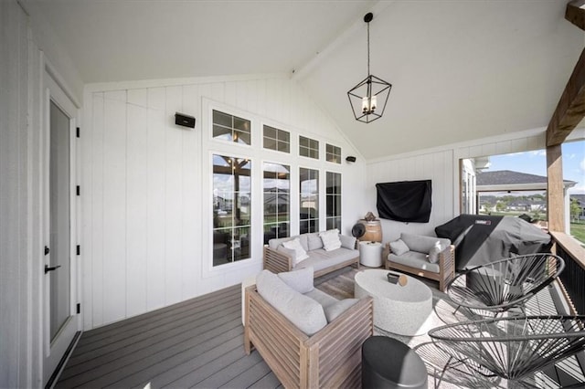 sunroom / solarium with an outdoor living space, beamed ceiling, and a notable chandelier