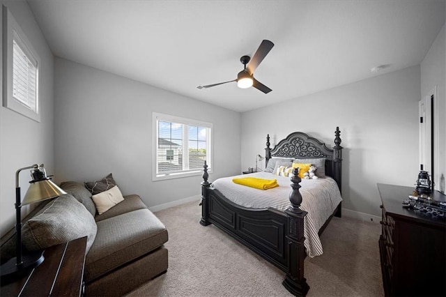 carpeted bedroom with baseboards and ceiling fan