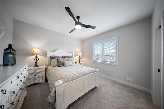 bedroom featuring baseboards, a ceiling fan, dark colored carpet, and visible vents